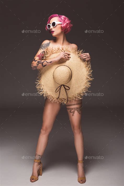 Attractive Naked Pin Up Girl In Sunglasses Covering By Straw Hat