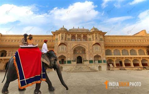 Female Tourists Enjoy Elephant Ride At Historic Amber Fort Royal Palace