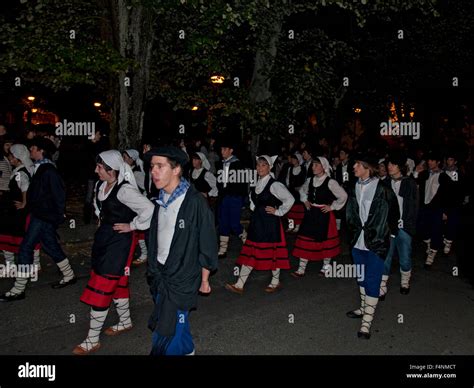 Local Basque People Marching Through Their Town In Traditional Basque