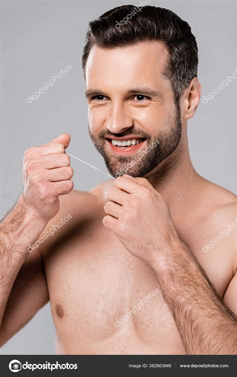 Cheerful Muscular Man Holding Dental Floss Isolated Grey Stock Photo IgorVetushko