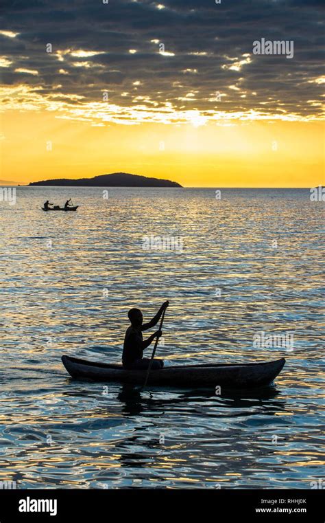 Man In A Little Fishing Boat At Sunset Lake Malawi Cape Maclear