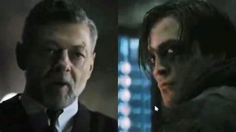 the batman clip shows batcave as andy serkis alfred clashes with robert pattinson on wayne