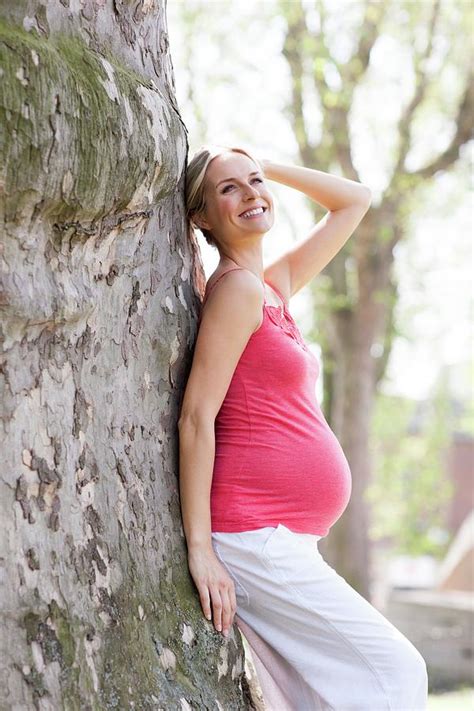 happy pregnant woman photograph by ian hooton science photo library fine art america