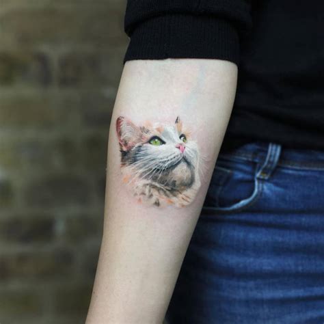 Realistic Cat Head Tattoo On The Inner Forearm