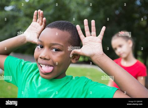 Cute Little Boy Making Silly Faces Outside Stock Photo Alamy