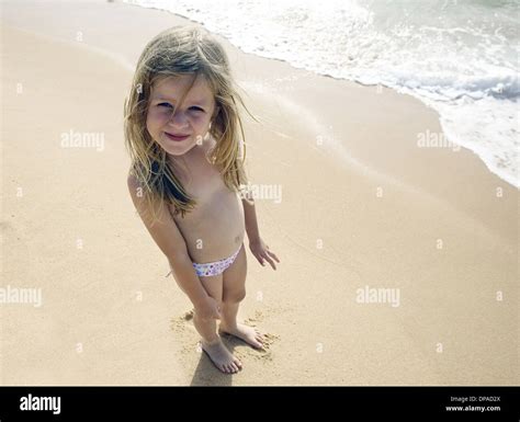 Girl Posing For Camera On Beach Stock Photo Alamy