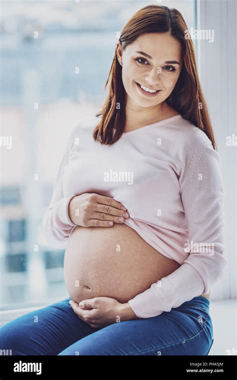 Amazing Pregnant Woman Sitting On Window Sill Stock Photo Alamy