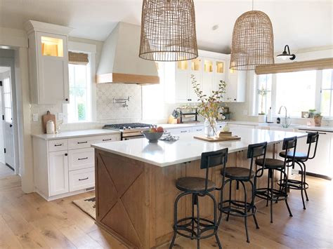A Stained Island Provides Contrast In This White Farmhouse Kitchen Interior Design By Janna