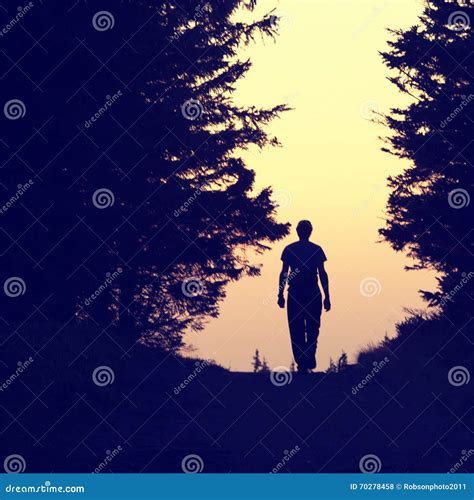 Silhouette Of A Lonely Man Walking Stock Photo Image 70278458