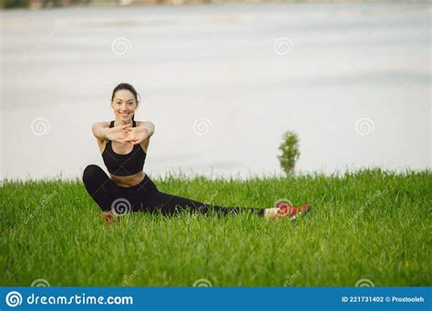 Woman Practicing Advanced Yoga By The Water Stock Photo Image Of Pose