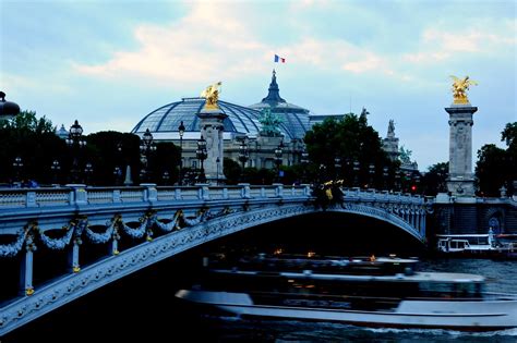 In this photo you can see the pont des arts, sometimes more well known as the bridge of love, spanning over the river seine and heading towards the institut de france. Ponte Alexander III bridge over Seine River, Paris. | Flickr