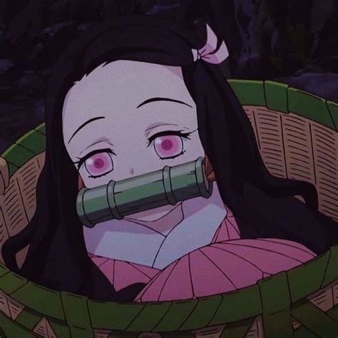 An Anime Character With Pink Eyes And Long Black Hair Is In A Wicker Basket