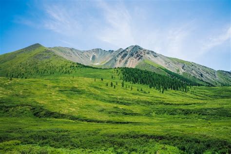 Premium Photo Giant Mountains Above Green Valley With Meadow And