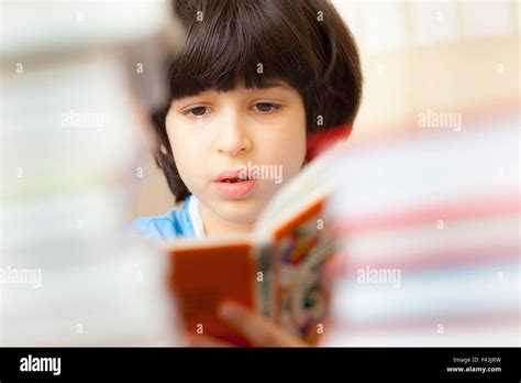 Child Reading A Book Stock Photo Alamy