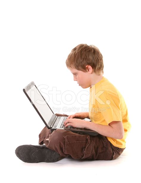 Boy Typing On A Notebook Computer Stock Photo Royalty Free Freeimages