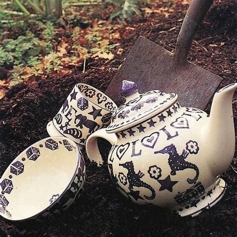 Vtg pottery ewer small pitcher blue glaze gold floral detail handle fluted spout. The front cover of our 1995 catalogue featured Purple ...