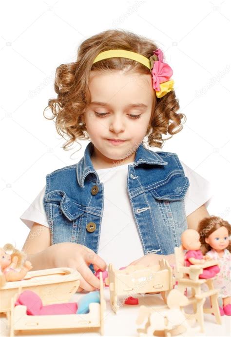 Little Girl Playing With Dolls Stock Photo By ©fotoatelie 40853225