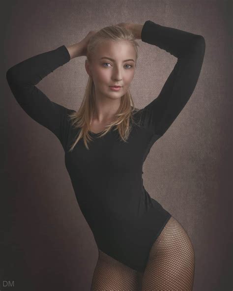 Photograph Of A Girl With A Beautiful Body Wearing A Bodysuit