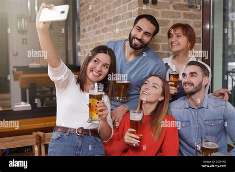 Group Of Friends Taking Selfies At Beer Pub Young People Enjoying