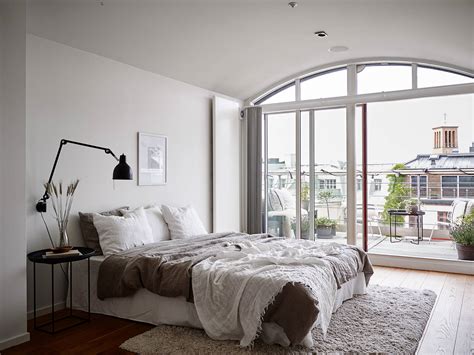 Home designing may earn commissions for purchases made through the links on our website. Neutral bedroom with a balcony view - COCO LAPINE ...