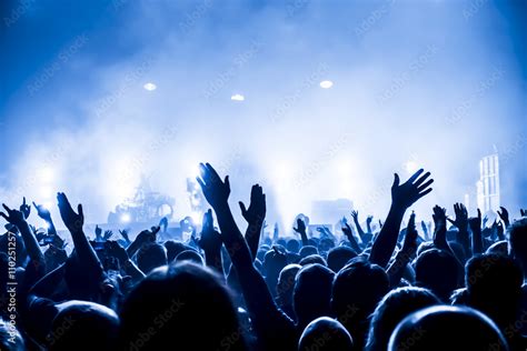 Silhouettes Of Concert Crowd In Front Of Bright Stage Lights Stock