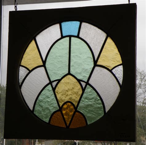 Taking on a circular silhouette with uneven edges, it showcases a geometric design with an intricate pattern and a rainbow. Antique Galleries of St. Petersburg - Home | Stained glass ...
