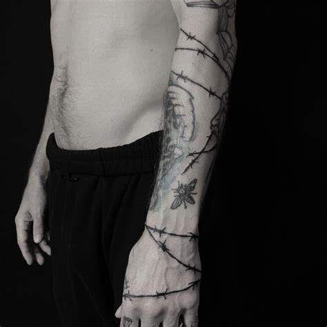 Image May Contain One Or More People Around Arm Tattoo Barbed Wire