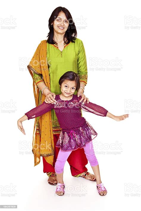 Isolated Portrait Of Cheerful Indian Mother And Daughter Standing Stock
