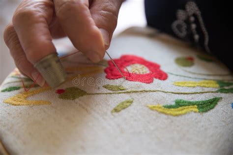 A Woman Embroidering A Handmade Dress Today Tailoring Can Be Called