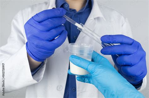 Plakat W Ramie Medical Laboratory Assistant Checks A Test Tube With Sperm Spermogram Male