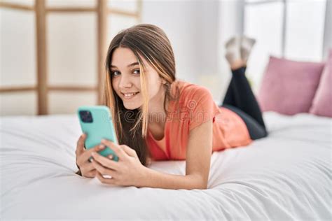Adorable Girl Using Smartphone Lying On Bed At Bedroom Stock Image Image Of Happy Lying