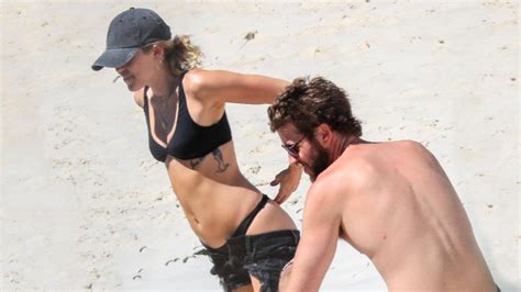 Miley Cyrus And Liam Hemsworth Heat Things Up On The Beach See The