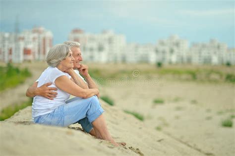 Elderly Couple Sitting On Sand Stock Image Image Of Love Friendship 53033911