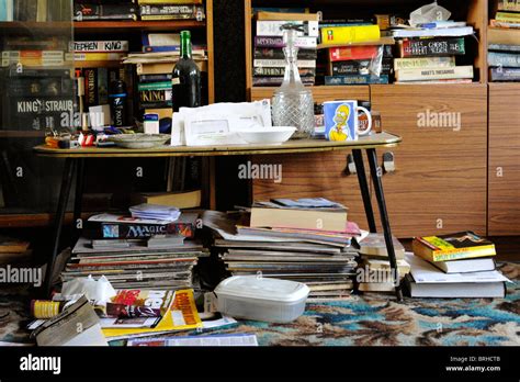 Untidy Living Room With Large Collection Of Books England Uk Stock