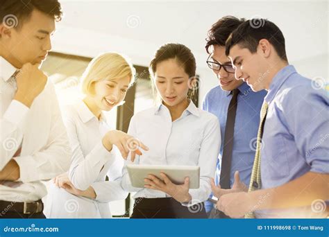 Business Group Discussing Plans And Meeting Stock Photo Image Of