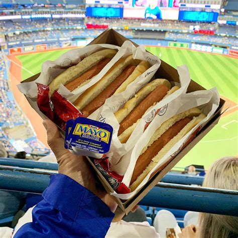 Woman Eats Poutine Hot Dog Each Toronto Blue Jays Run
