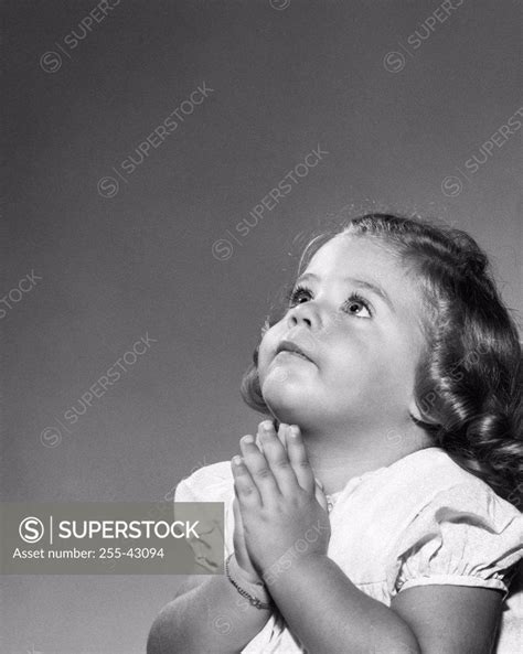 Close Up Of A Girl Praying Superstock