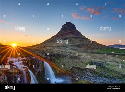 Mount Kirkjufell And The Kirkjufellsfoss In Iceland Before Sunset Stock