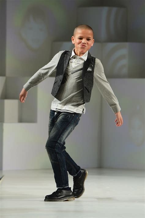 A Model Wearing Milly Minis Look 17 Autumnwinter 13 Walks The Runway At The Global Kids Fashion