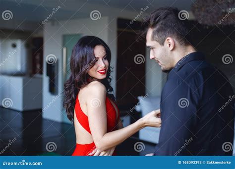 Woman In Red Flirting And Seducing Younger Man Stock Image Image Of