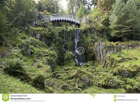 Waterfall And Bridge In Park Of Castle Wilhelmshoehe Kassel Germany