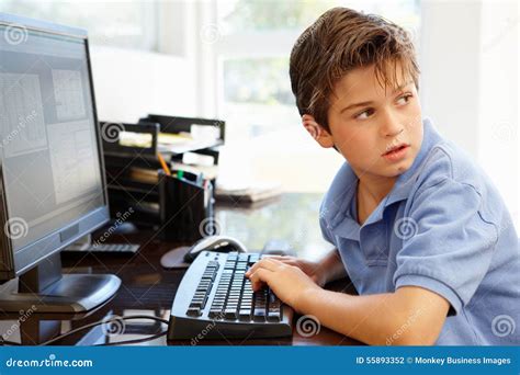 Young Boy Using Computer At Home Stock Photo Image Of Horizontal