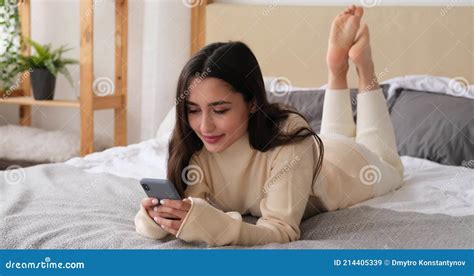 Woman Using Mobile Phone Lying On Bed Stock Video Video Of Bedding Media 214405339