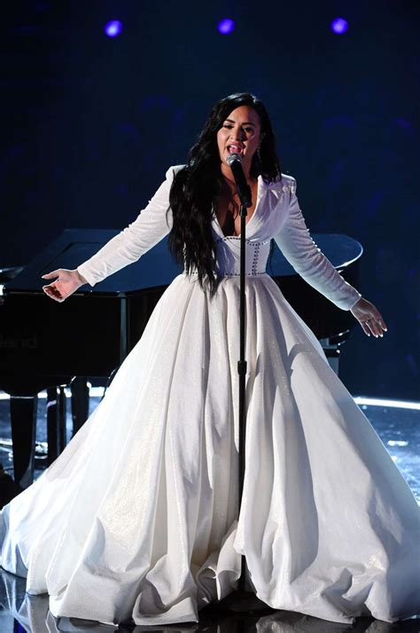 Demi Lovato Donning A Voluminous White Dress With A Crepe Fabric Full