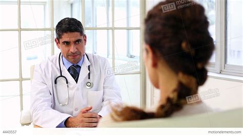 Doctor Speaking With His Sick Patient At Desk Stock Video Footage 4443557