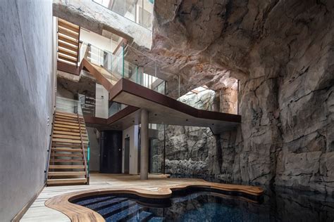 Modern Cave Villa Built Into A Massive Rock With Underground Grotto