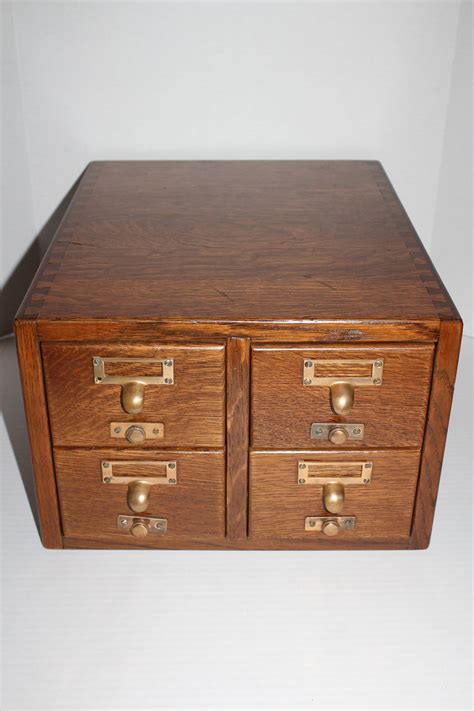 We have all seen the card catalogs at the library, and how efficient they can be with organization. Vintage Gaylord Oak Card File Cabinet 4 Drawer