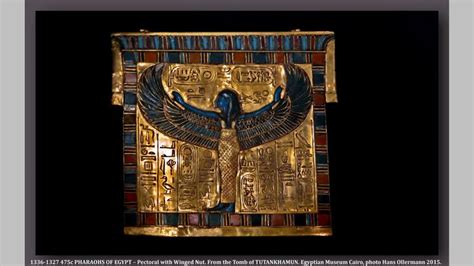 An Egyptian Gold Plaque With Blue And Red Designs