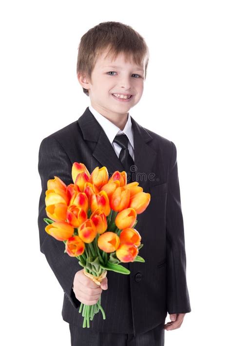 Portrait Of Cute Little Boy In Business Suit Giving Flowers To S Stock