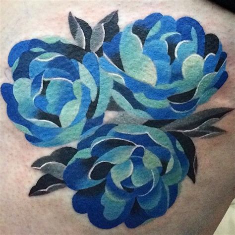 A Womans Thigh With Blue Flowers Painted On It
